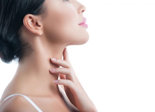 Woman with a sculpted chin after Kybella treatments