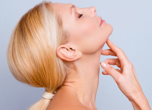 Woman looking up showing off her submentoplasty results