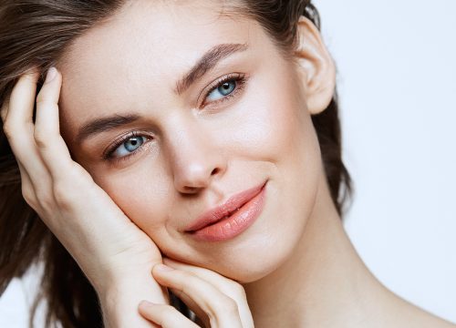 Woman with balanced face after receiving dermal fillers